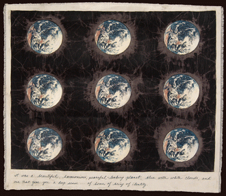 A batik showing nine Earths (full circles) against a dark background.