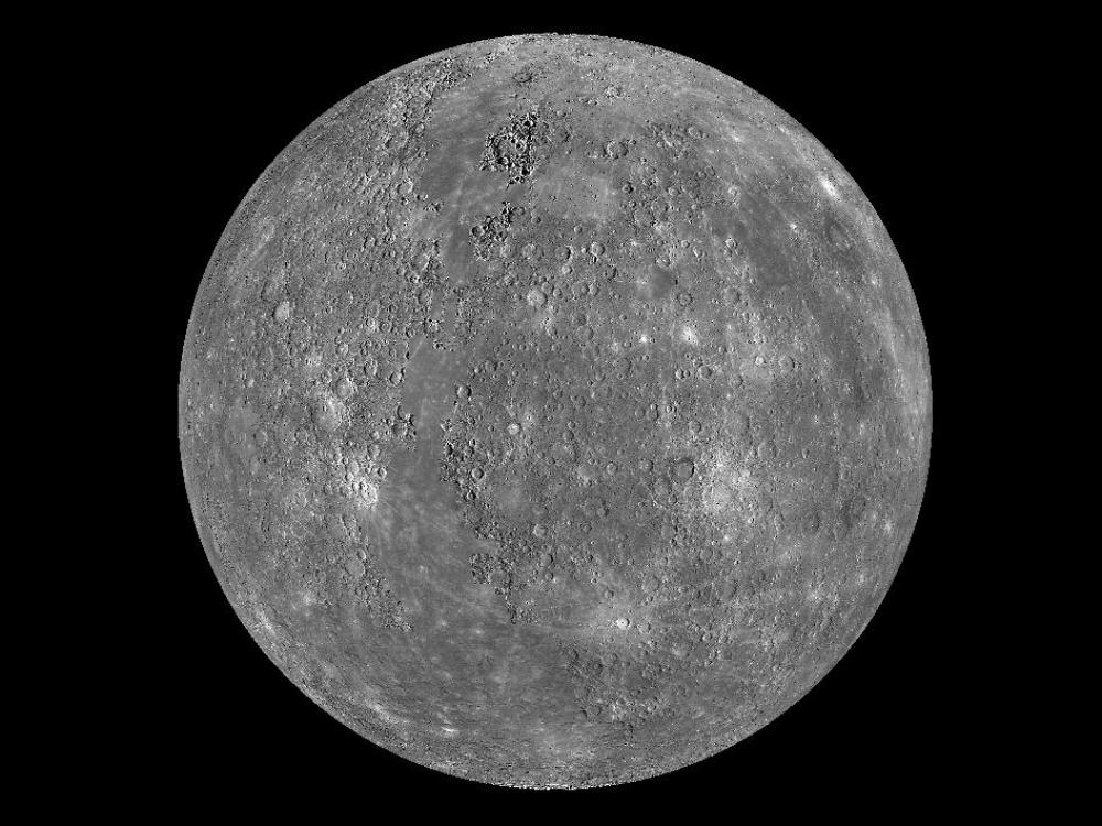 A grey circle with a textured face. 