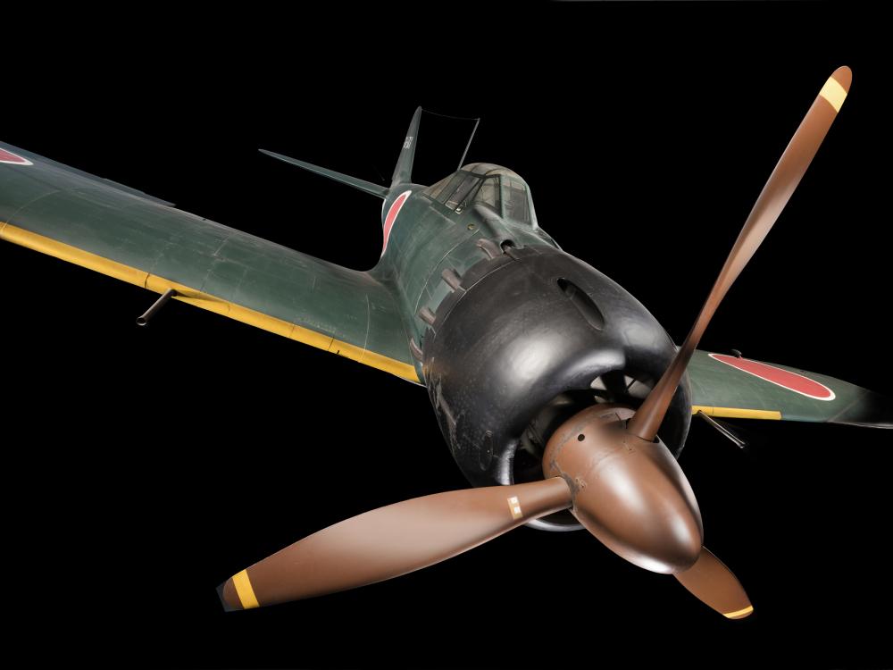 Front view of green tri-blade propellered Zero Fighter aircraft