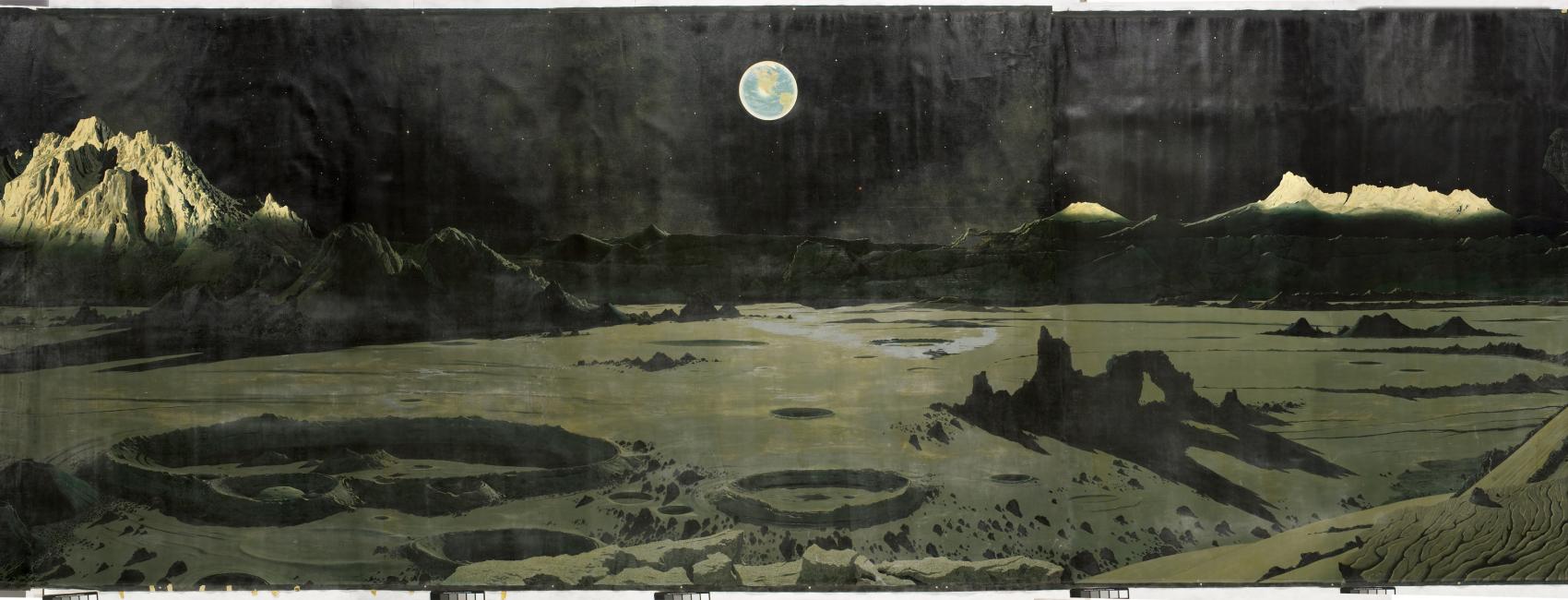 An imagining of what the moon's surface may look like. The Earth appears in the sky. 